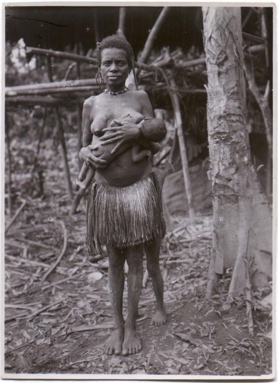 BD/38/8 - 
Woman with child at her breast.
