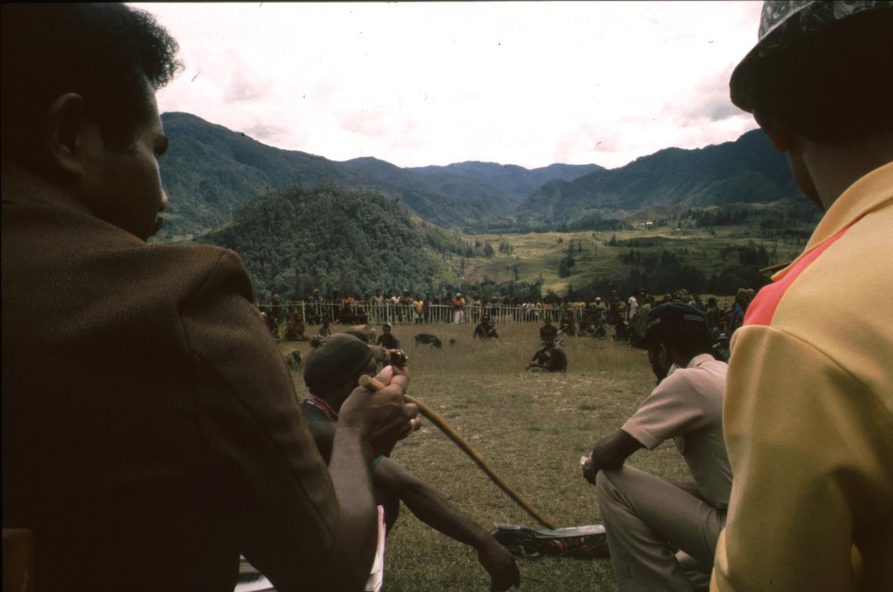 BD/166/200 - 
Man in brown uniform points with a stick
