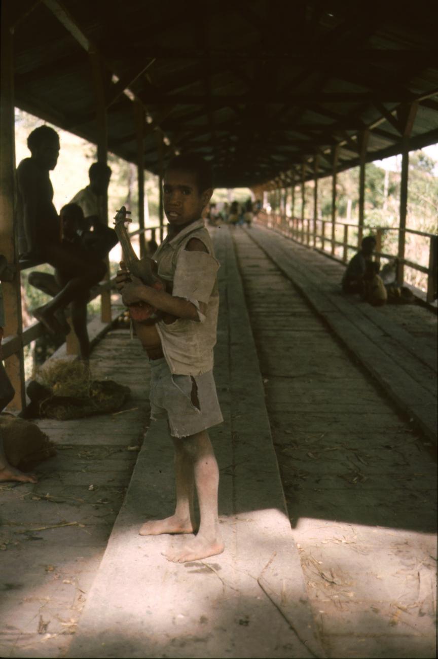 BD/166/218 - 
Boy on a roofed bridge
