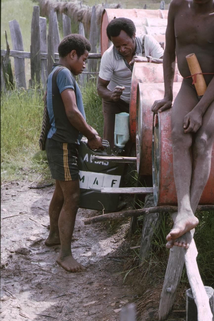 BD/166/257 - 
Filling a fuel can
