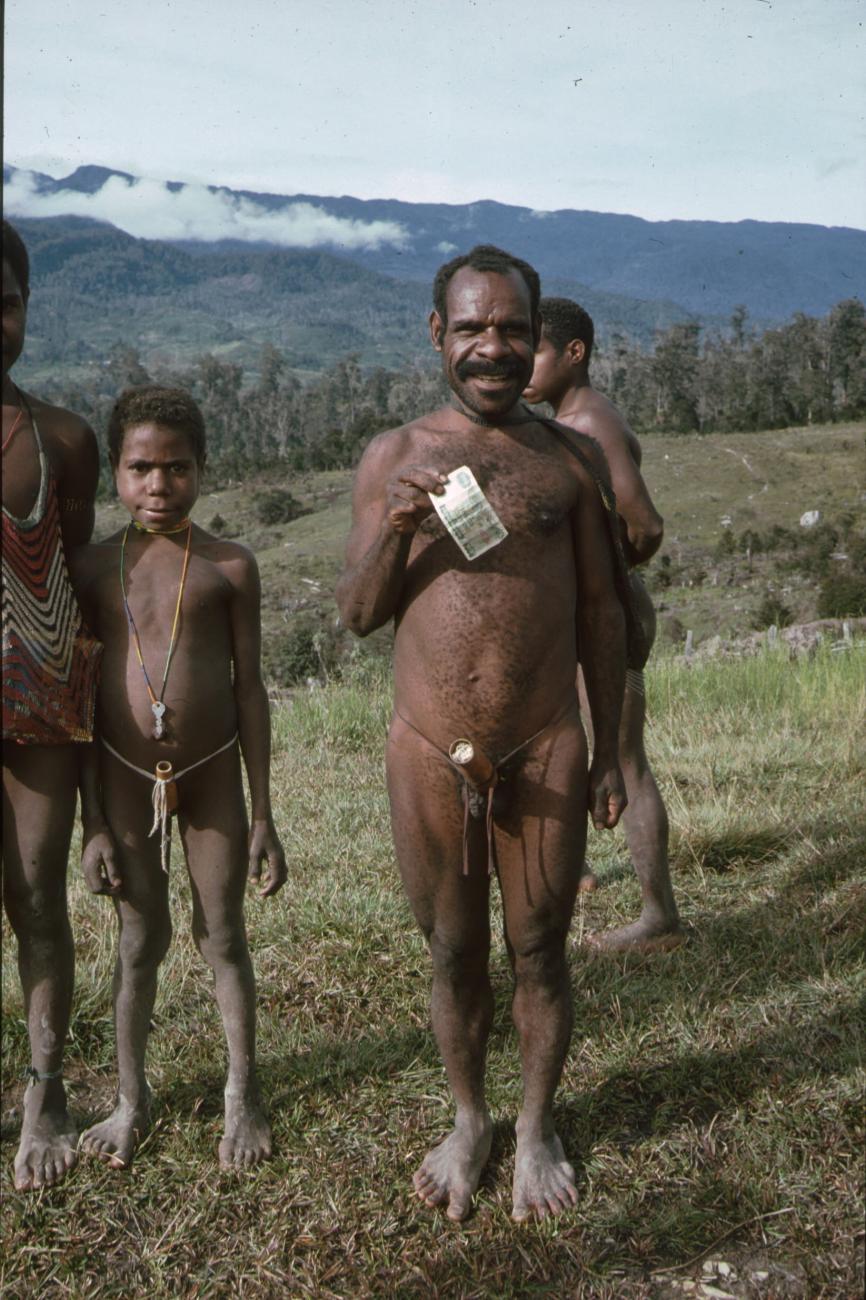 BD/166/329 - 
Group of Papua men in the open field
