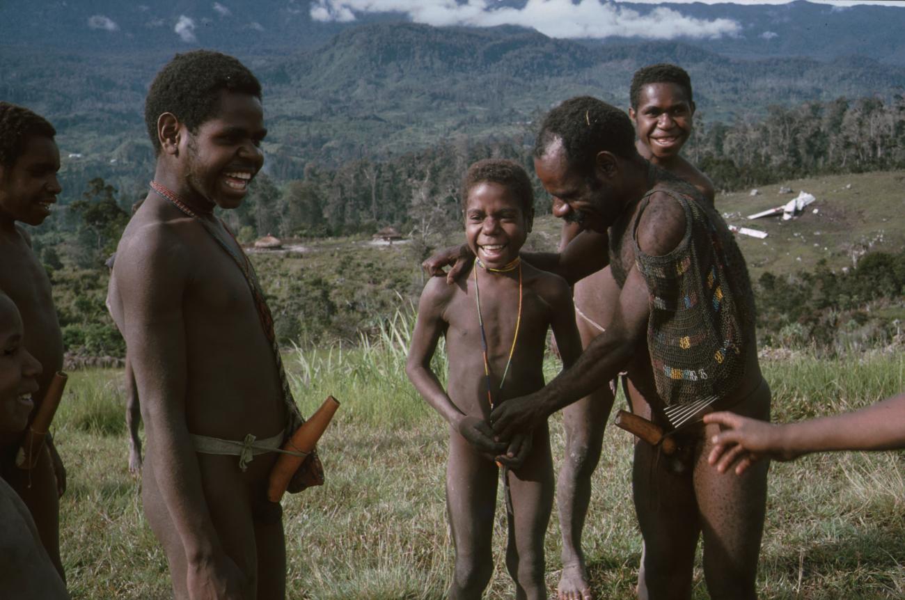 BD/166/329 - 
Group of Papua men in the open field
