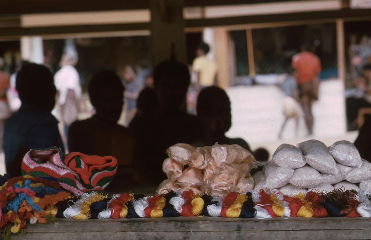 BD/166/73 - 
Textile and packaged food is displayed on the covered market
