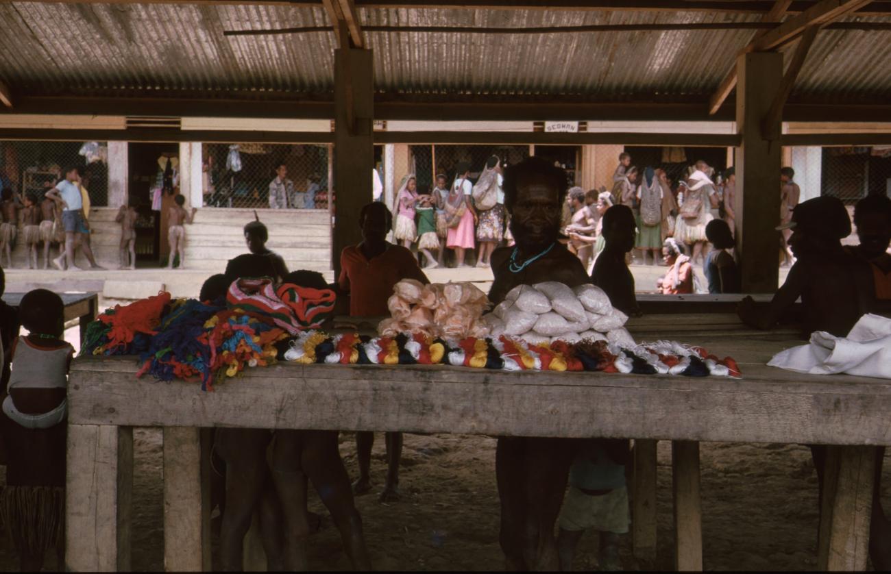 BD/166/74 - 
Textile and packaged food is displayed on covered market 2
