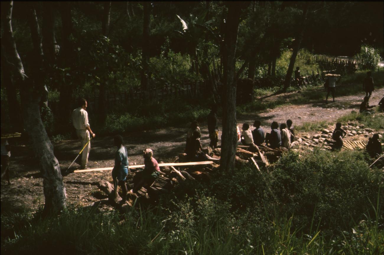BD/166/91 - 
Group of men resting in the forest
