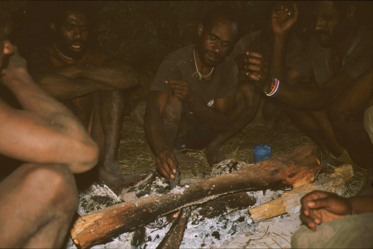 BD/166/97 -
Men around wood fire