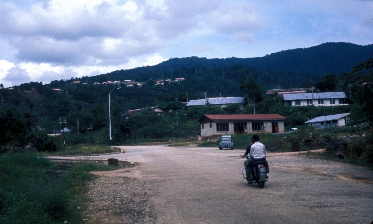 BD/22/33 - 
Road from Dock 5 to Hollandia-port (motor bike with two &quot;DETA-boys&quot;)
