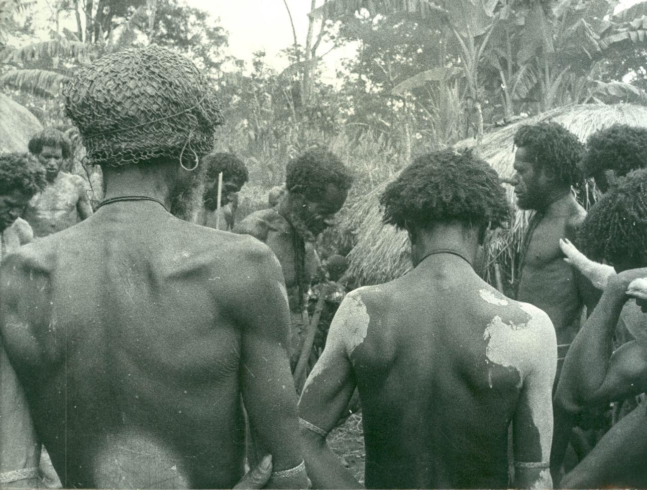 BD/40/33 -
Mountainland inhabitants covered in chalk during the pig feast ceremony