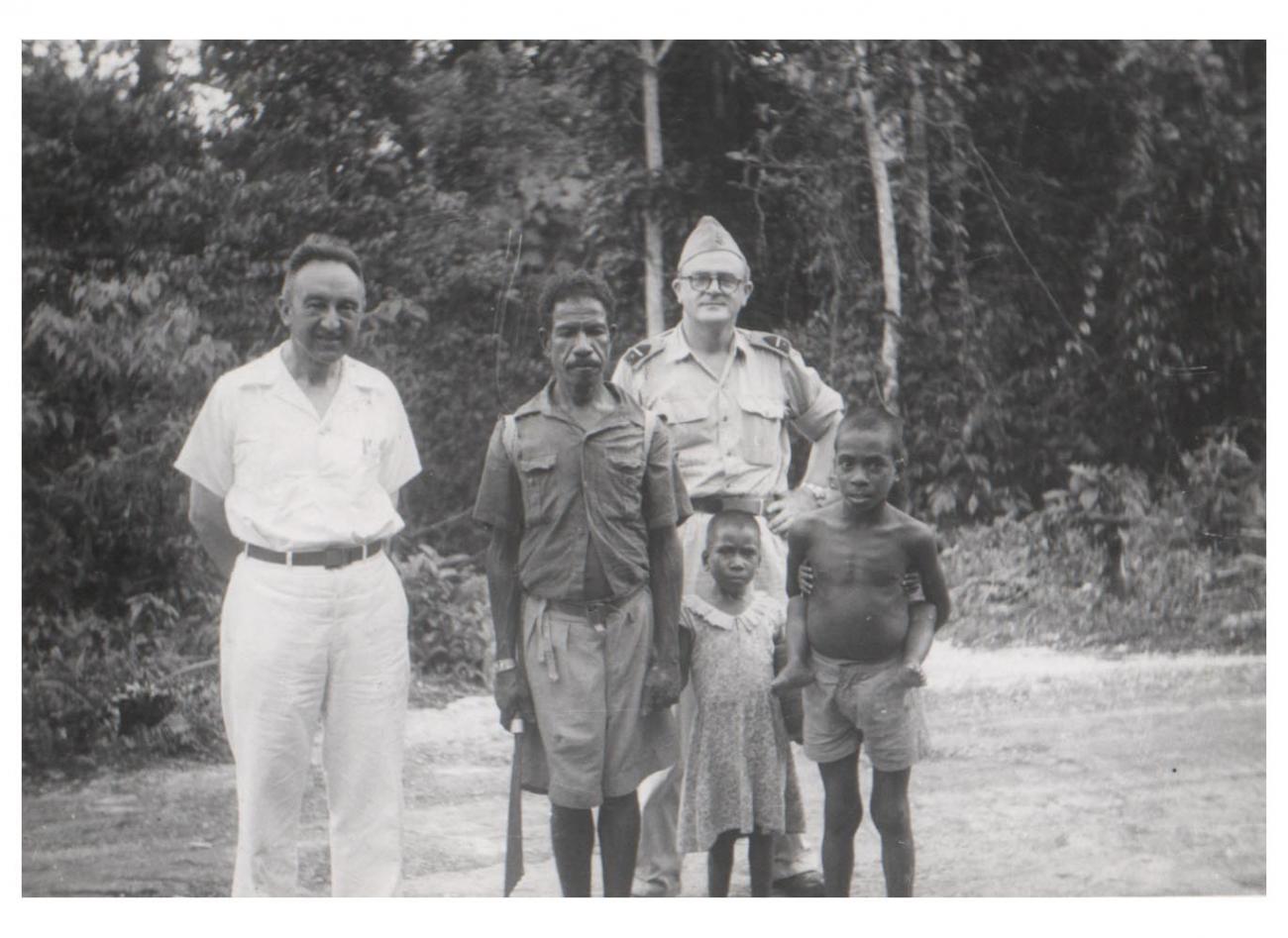 BD/54/50 -
Biak, Papuan posed group and Westerners