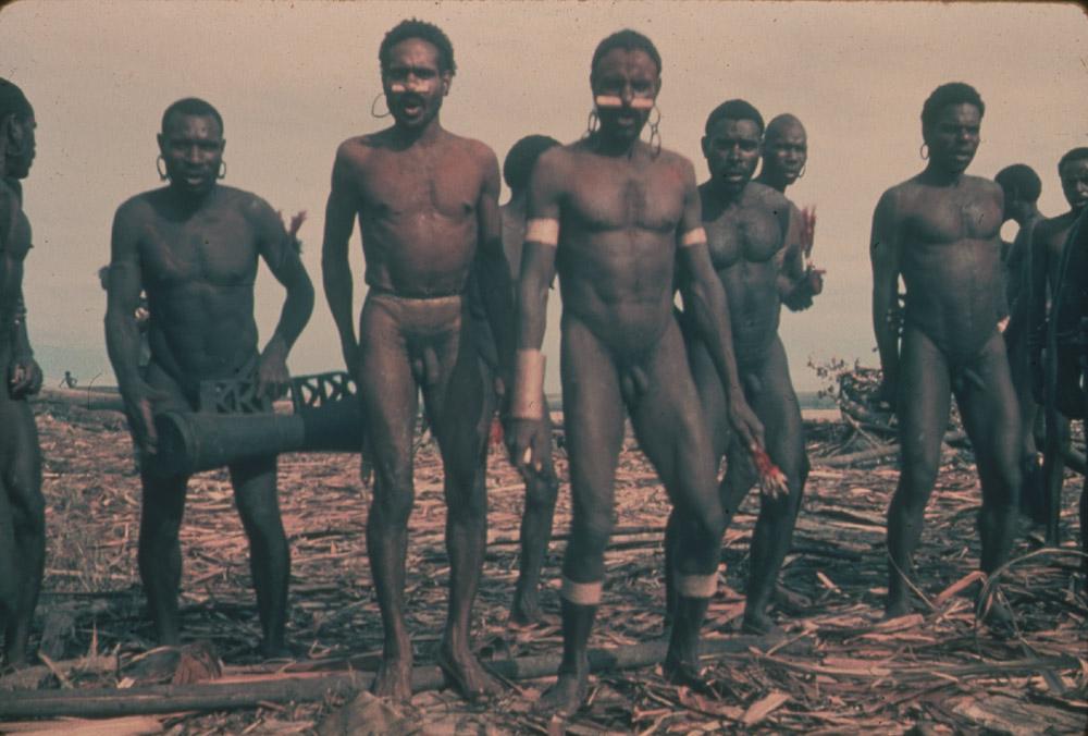 BD/30/52 - 
Dancing Asmat people with one man playing the drum
