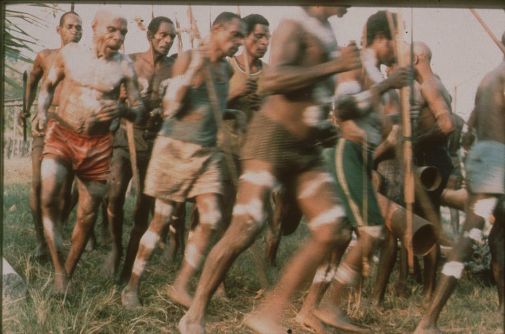 BD/30/72 -
Dancing Asmat men with bows and drums