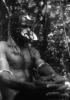 BD/216/58 Man uit de Asmat met neusversiering, haarversiering en armbanden