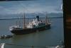 BD/171/1890 Afgemeerd schip in baai.
